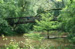 Janice on the first bridge over Turkey Creek