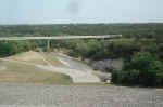 The San Gabriel River downstream of the dam, and the new road bridge.