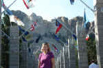 Janice at the Avenue of Flags, Mount Rushmore