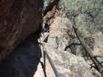 Janice on a narrow section of the High Peaks trail