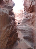 Janice on the ledge halfway down the first rappel