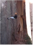 Janice rapelling down Morning Glory natural bridge