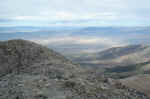 Looking West from the summit, with a wind farm in the distance