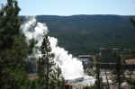 Old Faithful erupting, seen from Observation Point.